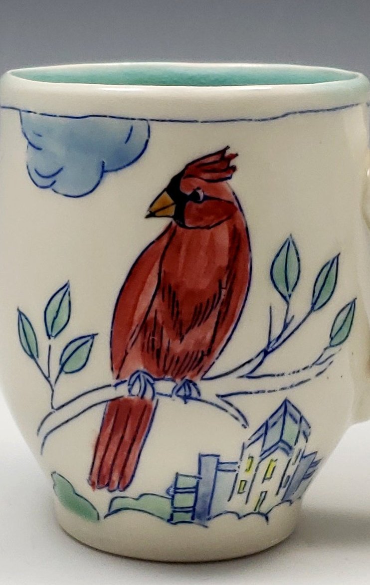 Tall mug with sitting cardinal